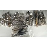 A large quantity of various sets of flatware and cutlery including servers, fish cutters/spoons of
