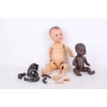 A black Armand Marseille dream baby 351, with two more dolls, a plastic black character HW (