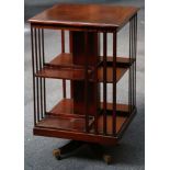 A mahogany, Georgian style, rectangular section revolving bookcase.