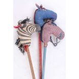 A small collection of toy hobby horses, to include one with wooden wheel and zebra example. (3)