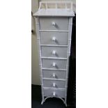 A pair of white painted faux bamboo narrow pedestal chests of seven drawers. (2)