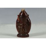 A Chinese snuff bottle, carved in the form of a fish, 7.5cm high.