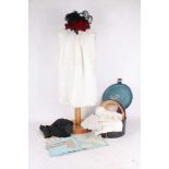 A collection of 1860s and later ladies' small bonnets, and babies' clothes, including a red velvet