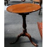 A 19th Century mahogany dished circular tip top pedestal tripod table with birdcage mechanism,