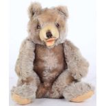 A 1960s Hermann Sitting mohair teddy bear, with open mouth, jointed neck and shoulders, brown