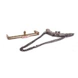 Two 1920s metal clasps for evening bags, including a gilt with rose quartz stone and one with
