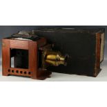 Archer's magic lantern, mahogany and tin housing, Beck 3/4" lens, carry box with information and
