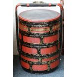 A Chinese lacquered four tiered circular food conveyor.