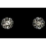 A pair of 18ct white gold and diamond set stud earrings.