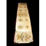 A fine embroidered silk altar curtain with springtime colours, of pink, blue and golden