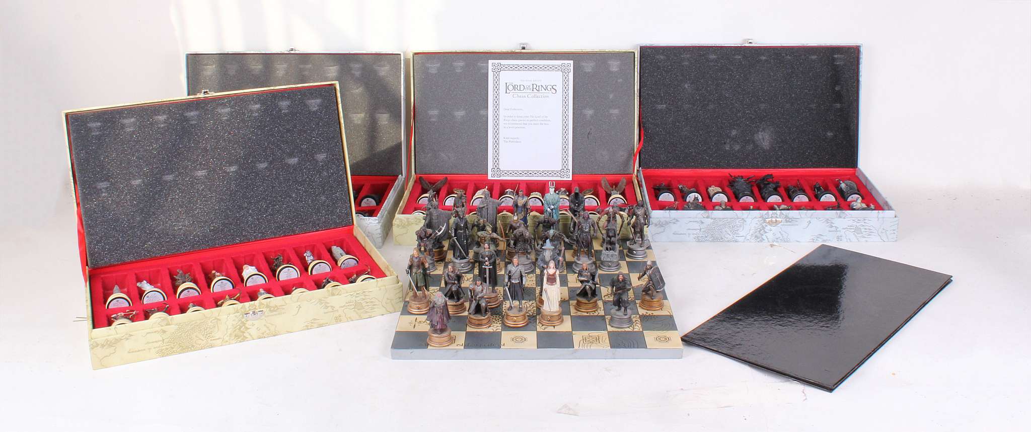 Three complete ‘Lord of the Rings’ Chess sets, by ©MMVI NLP, Inc., each set different (one set lacks