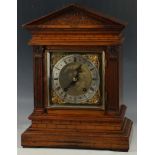 A late 19th Century continental architectural mantel clock, mahogany, with carving to frieze, reeded