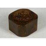 A Chinese jade seal, chamfered square with dragon to top, 4.9cm wide.