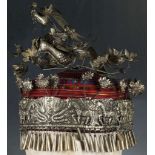 A Chinese miao ethnic minority, tribal headdress, ornately decorated with birds in white metal.