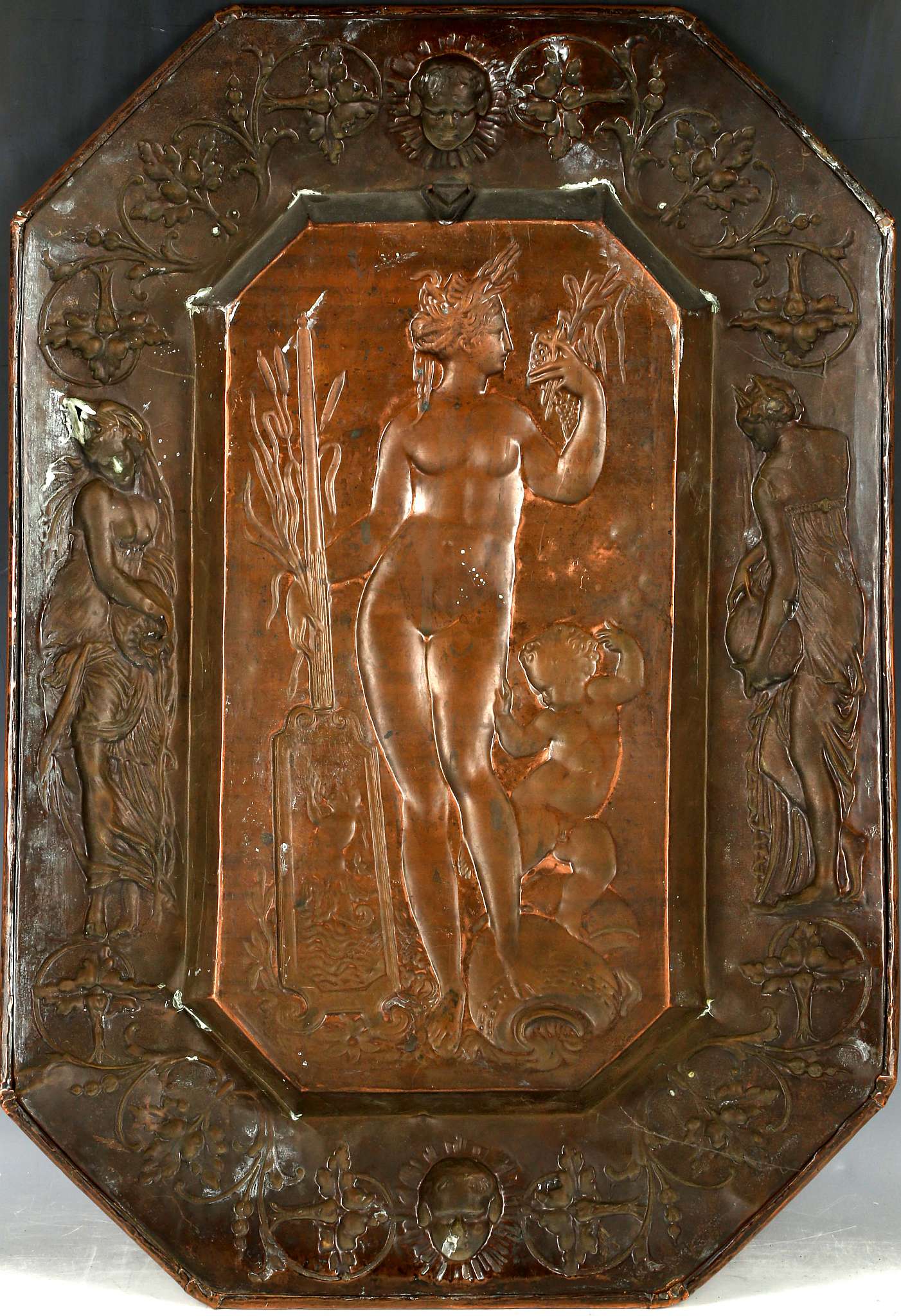 An octagonal repoussé copper dish with classical maiden, possibly Venus, surrounded by maidens. - Image 2 of 2