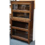 An early 20th Century Globe Wernicke four section bookcase, raised on bracket feet.