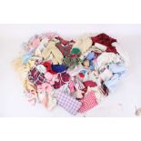 A large quantity of vintage dolls' clothes. (Qty)