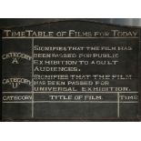 A 1940s war-time cinema blackboard denoting film categories and left blank for film titles and