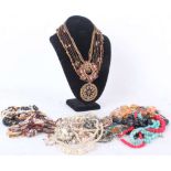 A quantity of costume jewellery including necklaces, chain and diamanté belts, brooches, rings and