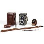 A Rolleiflex camera with incorporated light meter, Model T 2135313, sold with its leather case and