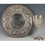 An early 20th Century modern silver goblet with engraved decoration, together with a white metal