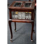 A stylish Art Deco glazed drinks cabinet with cantilevered rising action (and fully fitted) on