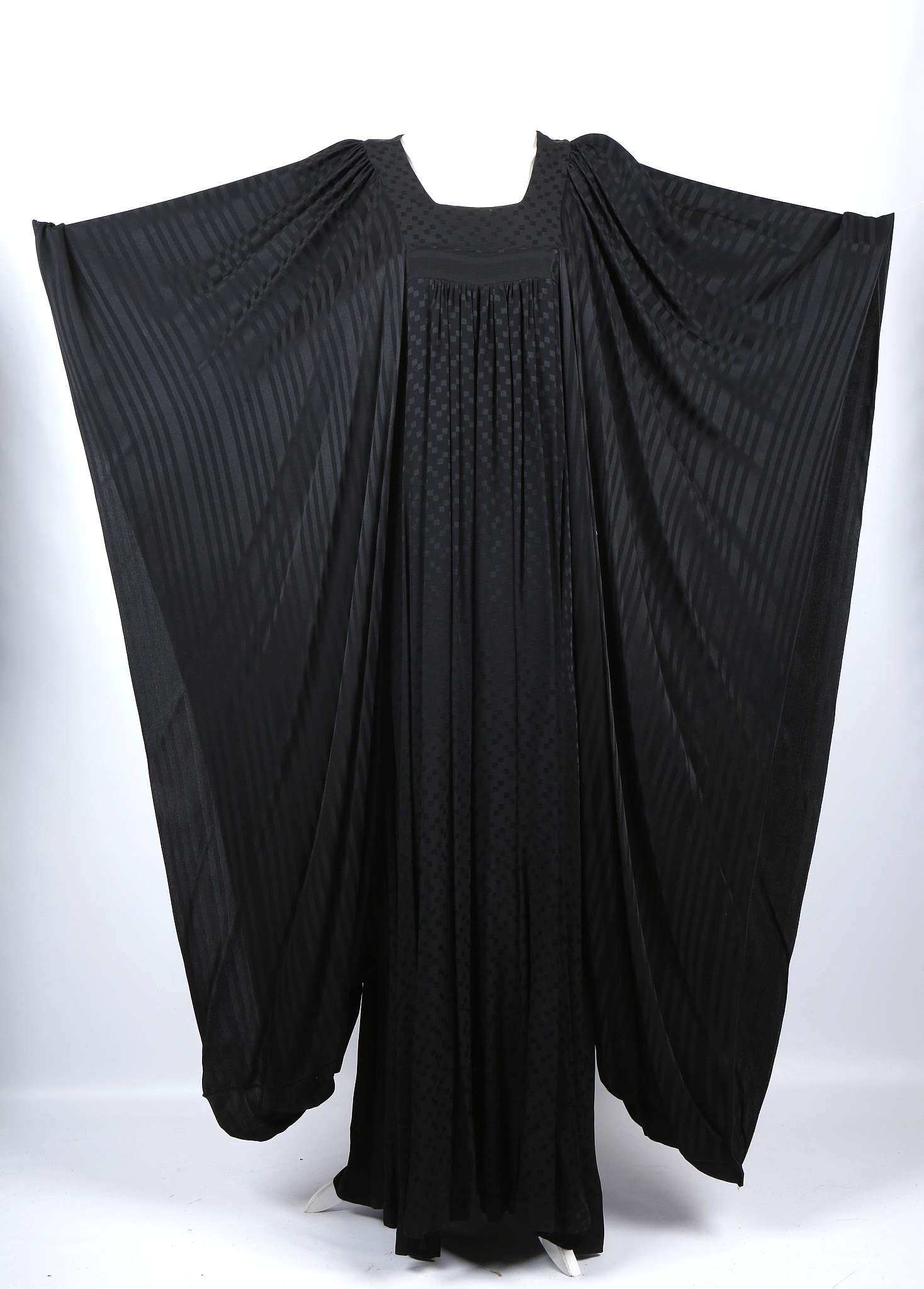 A 1970s Gina Fratini black full length dress, with empire line and large Japanese Kimono style