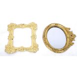 Two Victorian dolls house gilt pressed metal picture frames, one with a mirror, 8cms. (2)