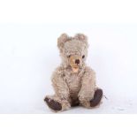 A 1940s Hermann Zotty Teddy bear, German, with brown glass eyes, brown stitched nose, mouth and