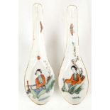A PAIR OF CHINESE SPOONS. 
Late Qing Dynasty. 
Each painted in enamels with a beauty relaxing