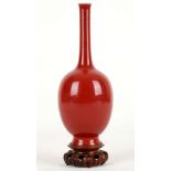 A CHINESE MONOCHROME RED VASE BOTTLE VASE. 
Kangxi mark and of the period. 
With globular body and a