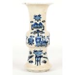 A CHINESE BLUE AND WHITE GU-FORM VASE. 
Late Qing. 
Decorated with various archaic vessels on a