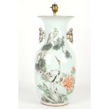 A CHINESE BALUSTER VASE. 
20th Century. 
With two gilt handles, decorated with a pair of cranes