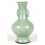 A CHINESE CELADON DOUBLE EARED VASE. 
Qing Dynasty, 18th Century [not Ming]. 
Of pear shaped