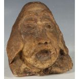 A folk art head of a knight, carved from the tip of a stalagmite, 14cm high.