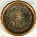 A late 17th/early 18th Century oval shaped and glazed silk portrait study of a Bishop