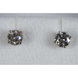 A pair of 14ct white gold and diamond stud earrings (diamond 1.17ct).