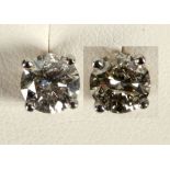A pair of 18ct white gold and diamond stud earrings (diamond 2.04ct).