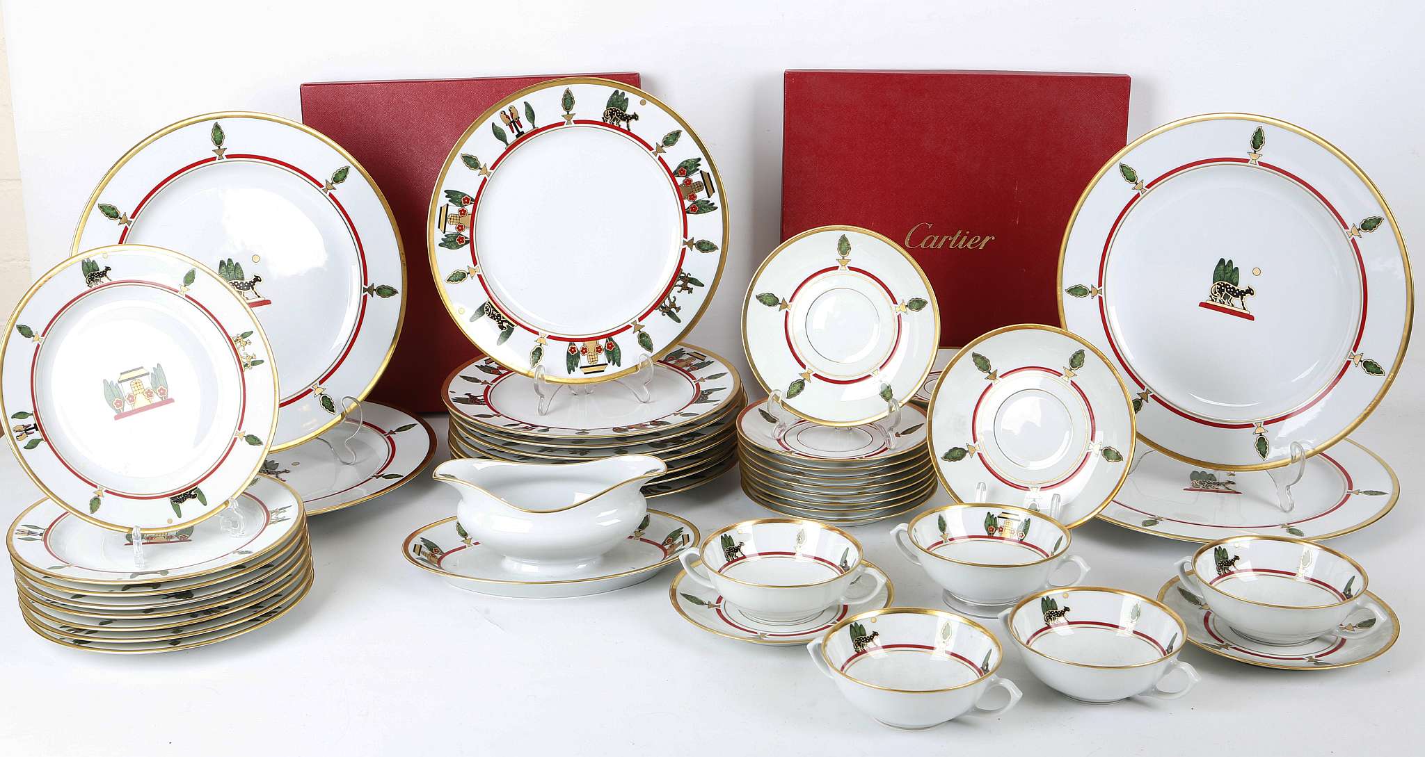 A Cartier dinner service, late 20th century, to include four large boxed dinner plates, five soup