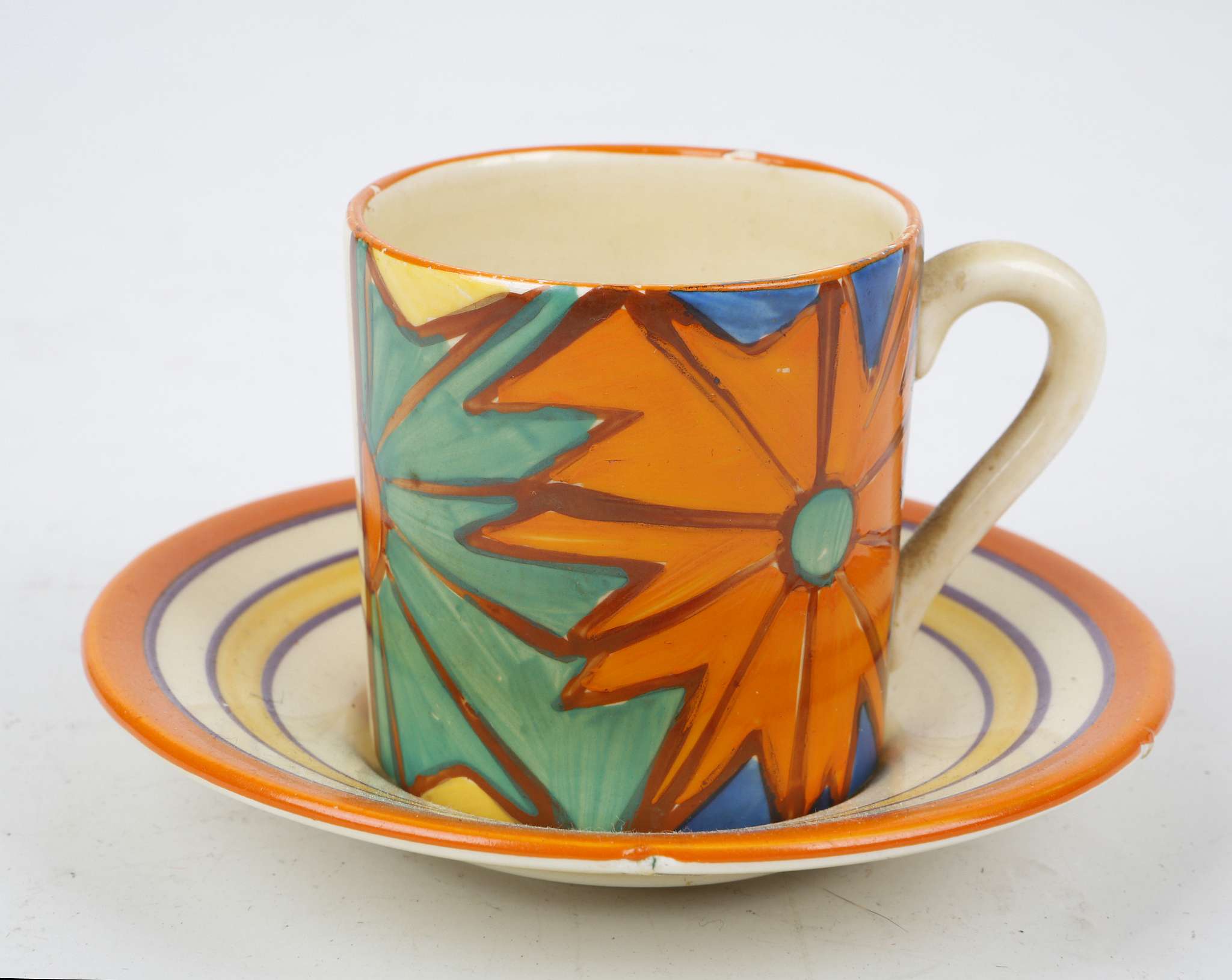 A Clarice Cliff Fantastique ''Umbrellas & Rain' coffee cup and saucer, painted in colours, (Cup; 5cm