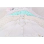 Twenty-one hand knitted baby clothes.