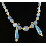 A faceted aqua marine bead necklace with .925 silver gilt spacers/clasps, sold together with