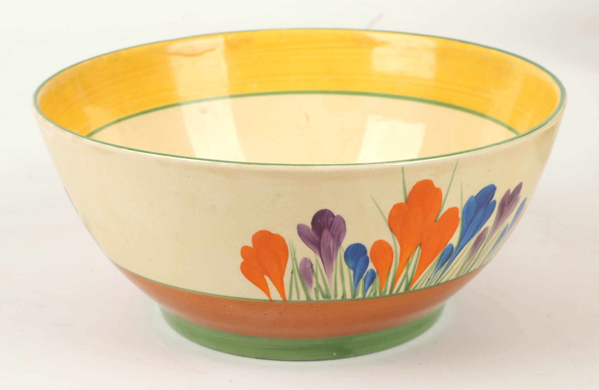 A Clarice Cliff Bizarre Crocus pattern bowl, painted in colours, (22cm diam).