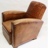 A French 1930's brown leather arm chair, (82cm wide x 86cm deep).