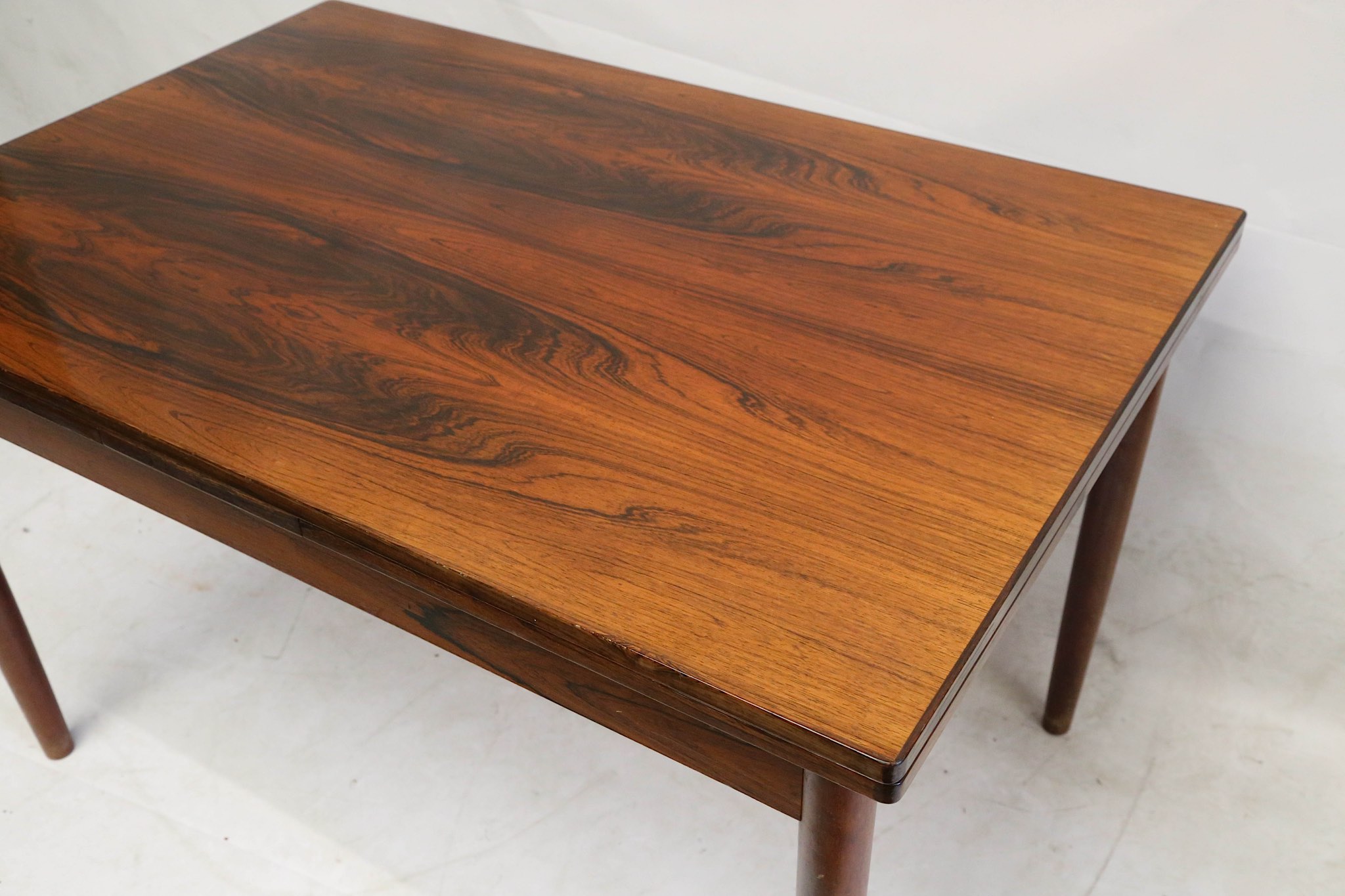 A 1960s Danish rosewood extending dining table, with a pull out leaf at each end, (121 x 80 x 76cm - Image 4 of 4