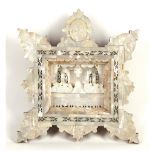 A 20th century carved mother of pearl scene of the Last Supper, set within a shaped and engraved