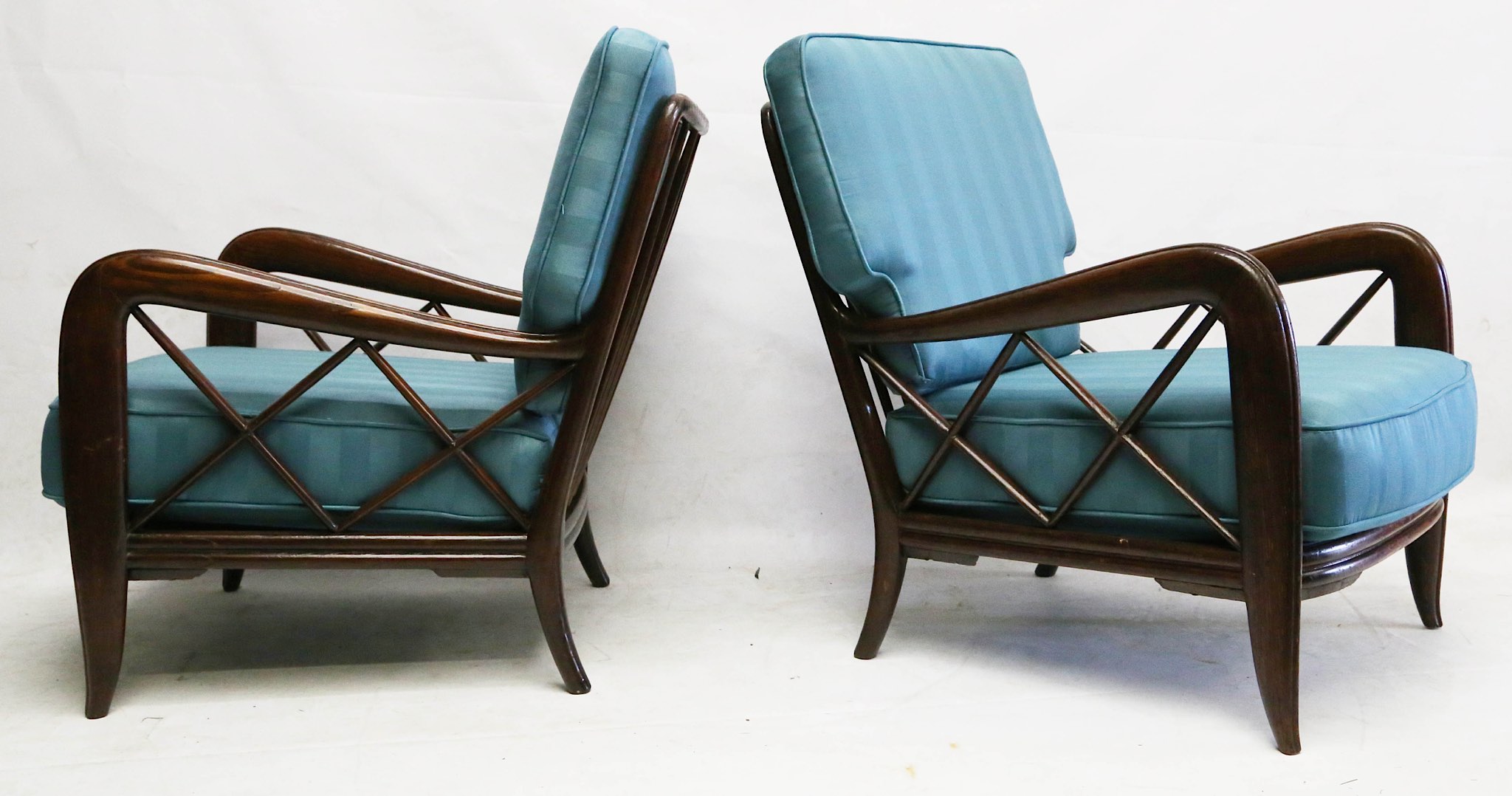 Attributed to Paulo Buffa, a pair of 1950s lounge chairs, oak frame with blue-striped part-silk