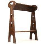 A Liberty & Co. of Regent Street style Arts & Crafts oak book stand, 59 x 23 x 76cm high