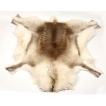 A modern reindeer skin rug.