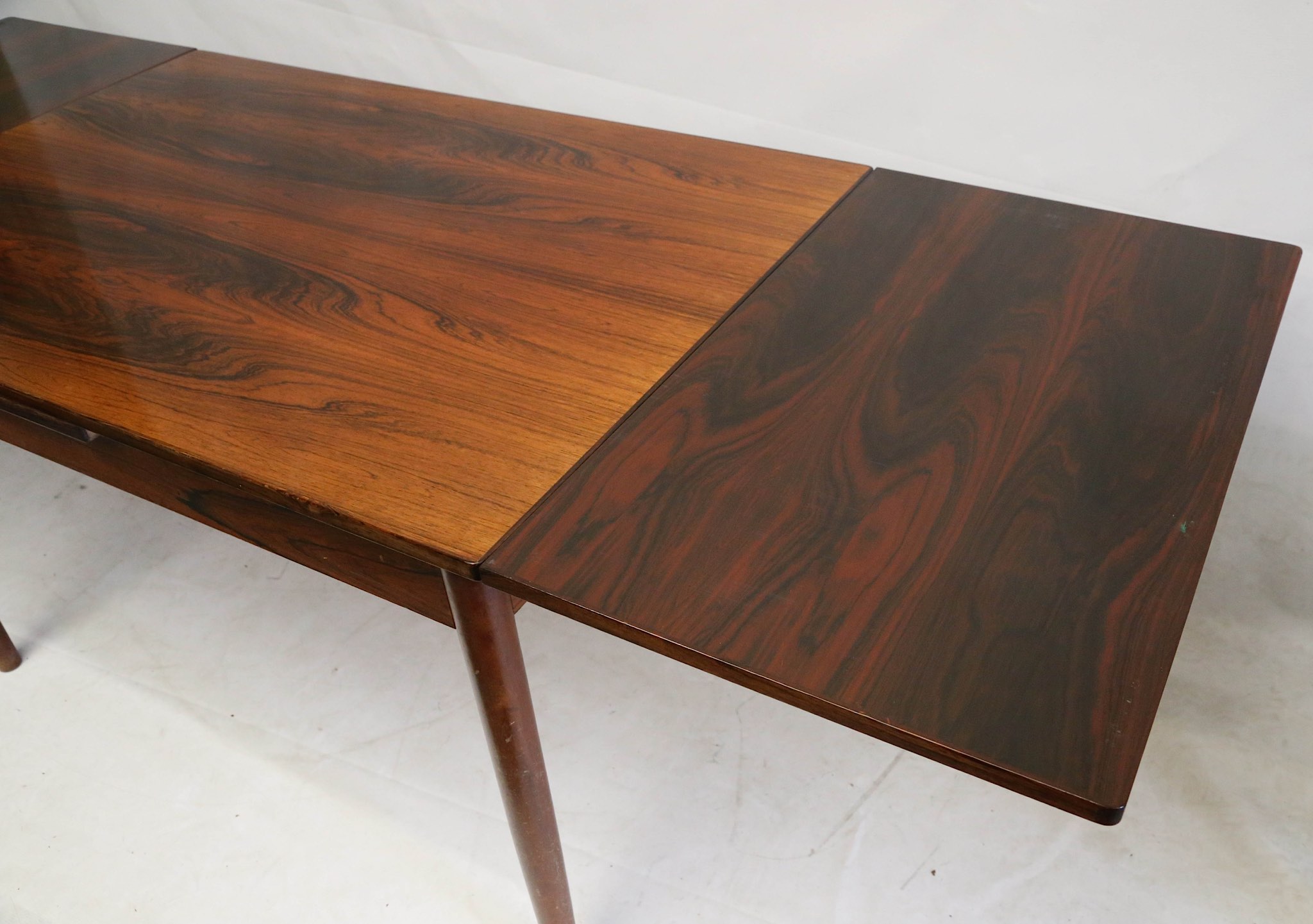 A 1960s Danish rosewood extending dining table, with a pull out leaf at each end, (121 x 80 x 76cm - Image 2 of 4